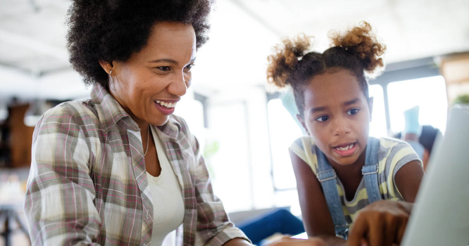 woman working from home while parenting